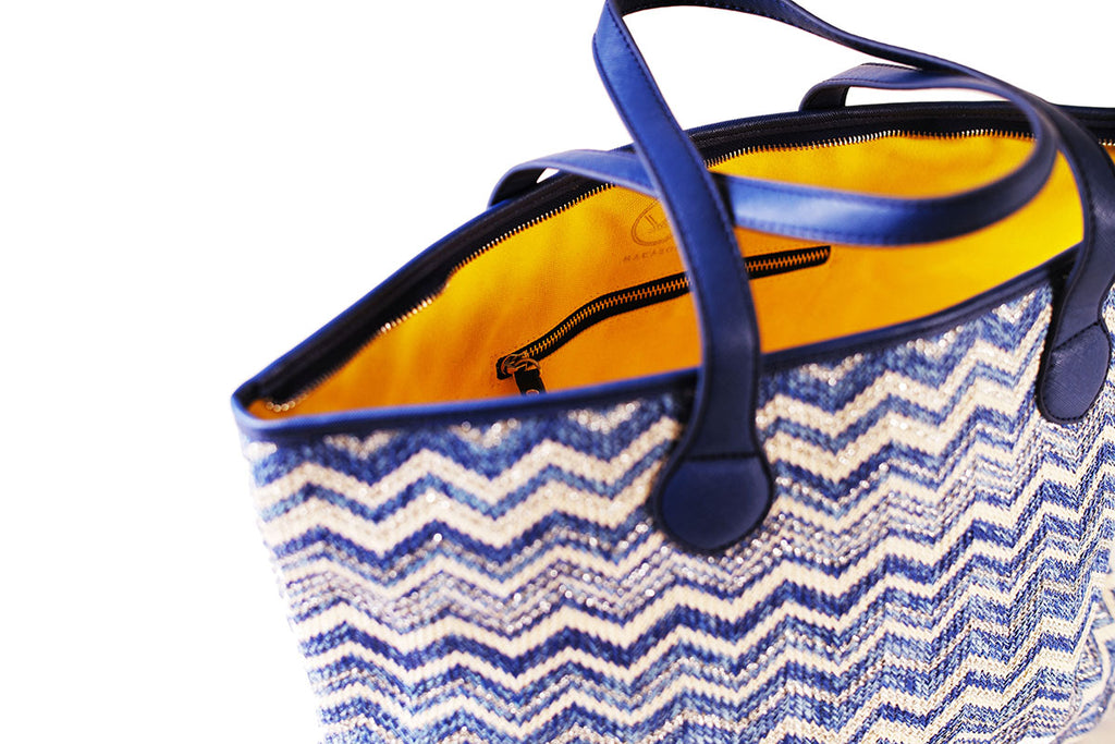 blue silver tote bag with yellow canvas lining and pockets