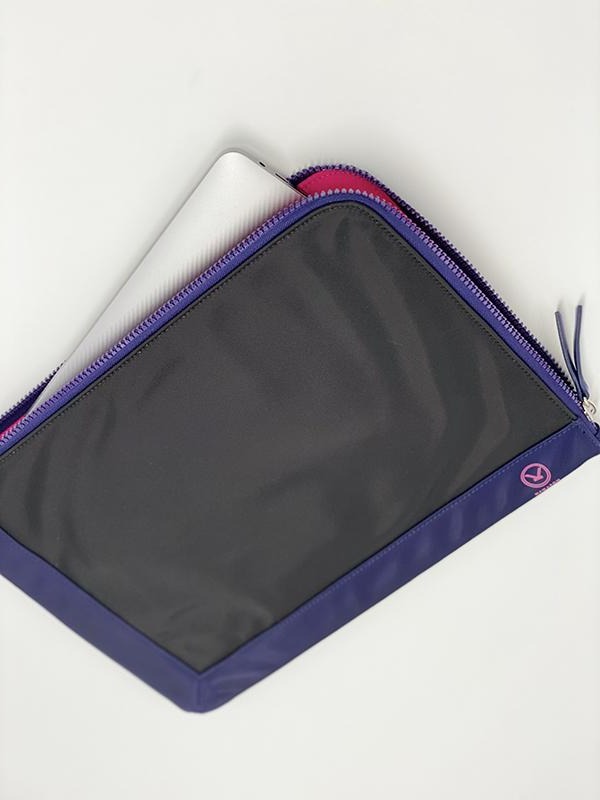 A chic fully padded laptop sleeve made by water-resistant nylon and faux leather in the color of jet black and blue.
