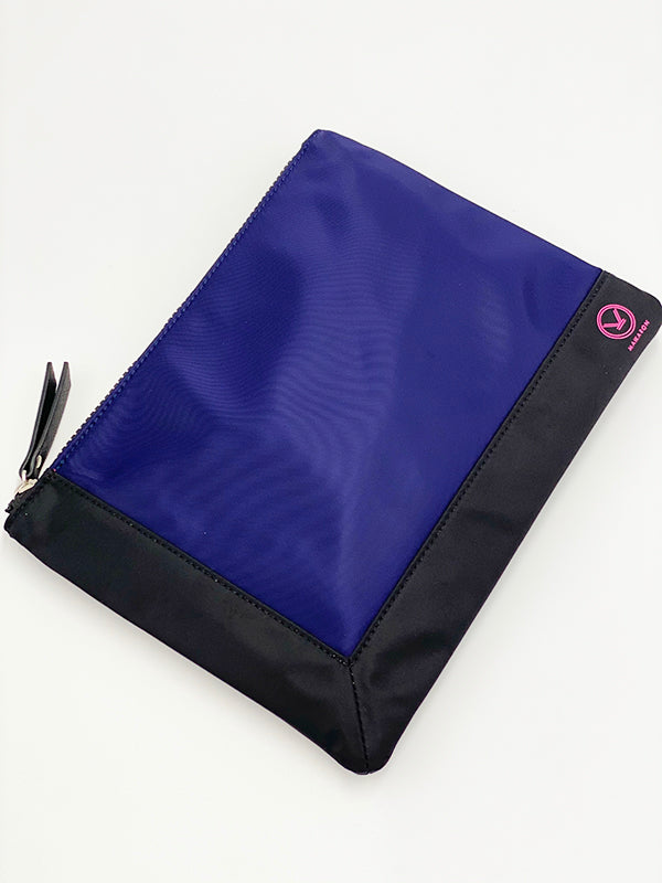 A stylish blue black water resistant pouch with zipper made of 100% polyester and faux leather that can be used as a cosmetic bag.