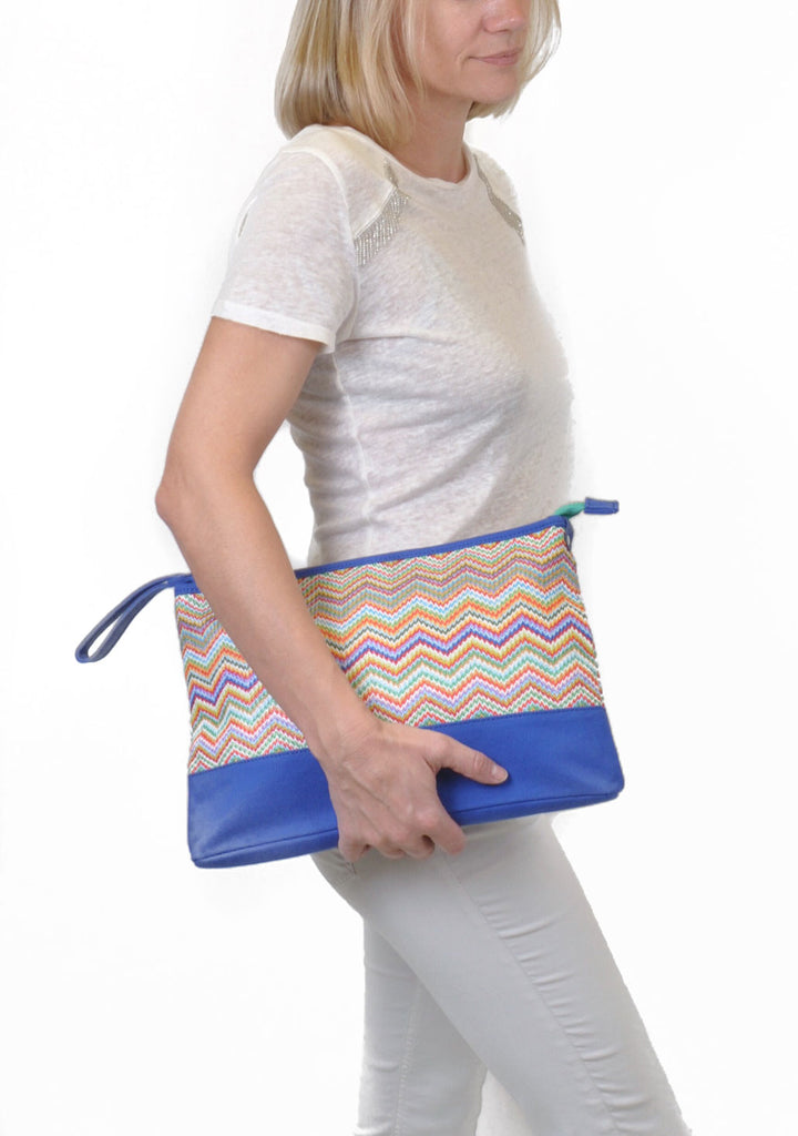 woman carrying designer makeup bag