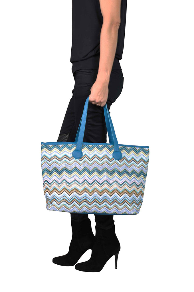 woman wearing a travel tote bag